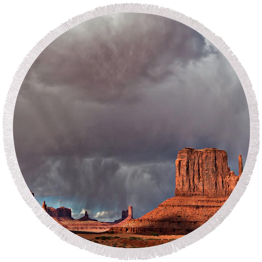 Desert Round Beach Towel featuring the photograph Storm over Monument Valley by Wesley Aston