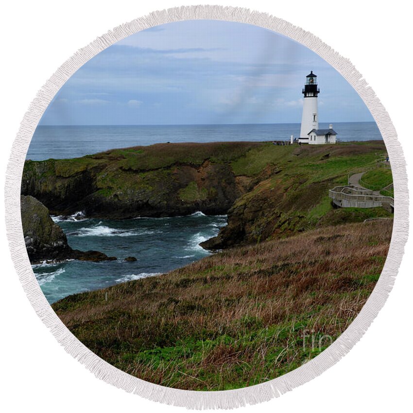 Denise Bruchman Round Beach Towel featuring the photograph Stormy Yaquina Head Lighthouse by Denise Bruchman