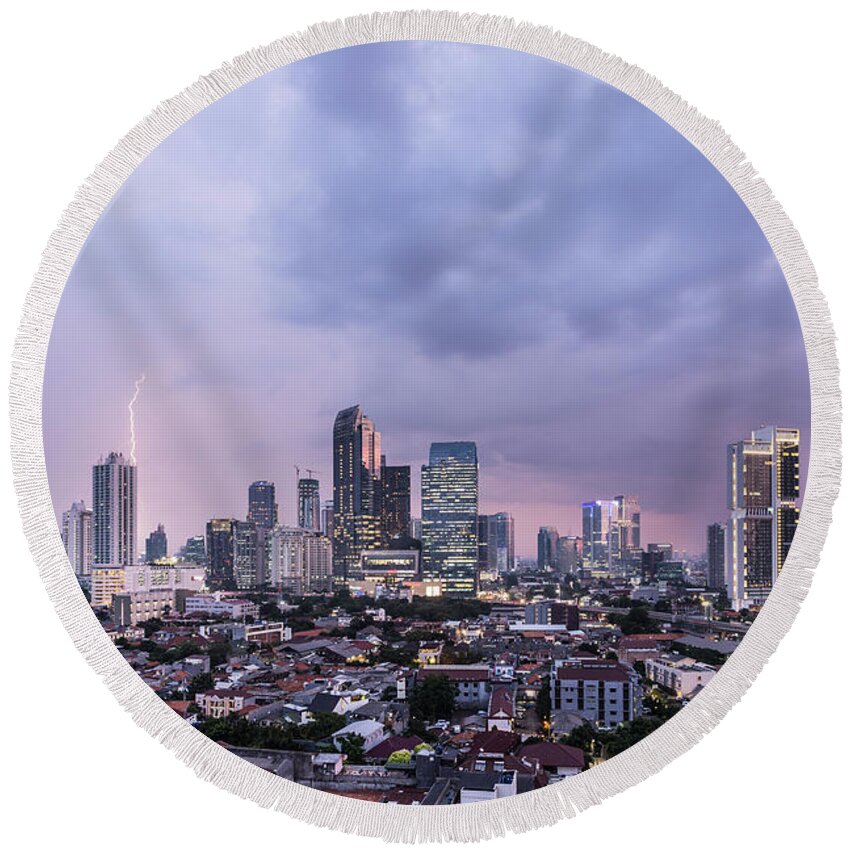 Capital Cities Round Beach Towel featuring the photograph Stunning sunset over Jakarta, Indonesia capital city by Didier Marti