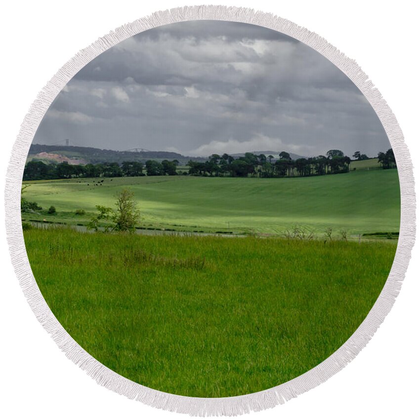 Beecraigs Round Beach Towel featuring the photograph Sunny patches on the field. by Elena Perelman