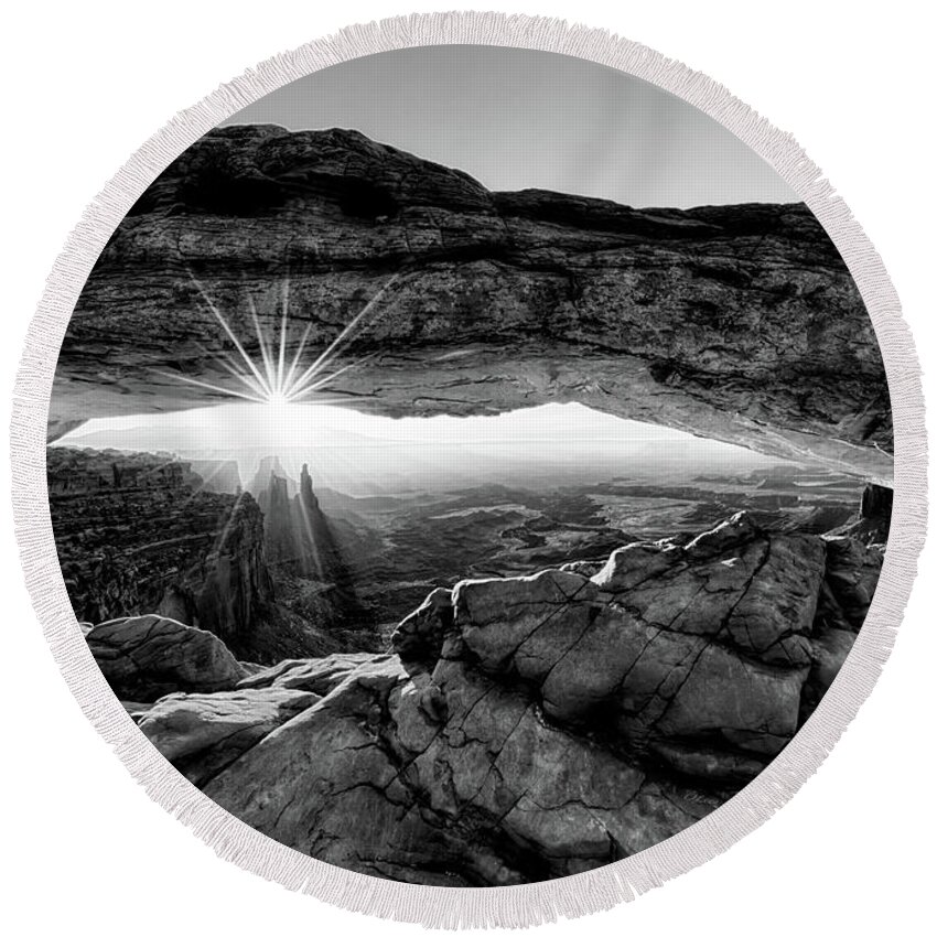 Mesa Arch; Utah; Canyonlands; National Park; Sunrise; Arch; Red; Brown; Desert; Butte; Dawn; Morning; Remote; Beauty; Sun; Sunburst; Rays; Sunlight Glowing Round Beach Towel featuring the digital art Supernatural West - Mesa Arch Sunburst in Black and White by OLena Art by Lena Owens - Vibrant DESIGN