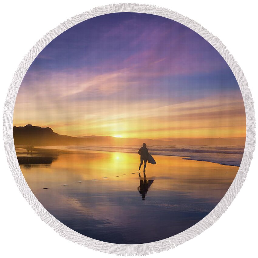 Surfer Round Beach Towel featuring the photograph Surfer In Beach At Sunset by Mikel Martinez de Osaba