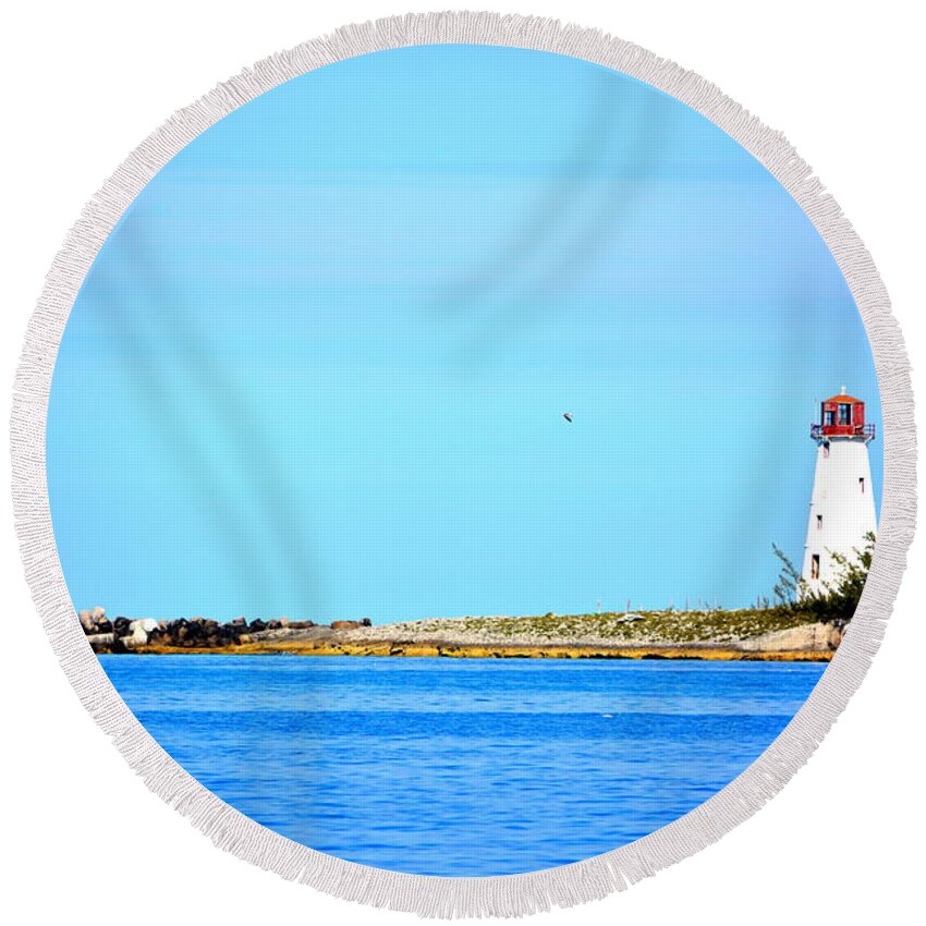  Round Beach Towel featuring the photograph The Lighthouse at Sea by Kimberly Woyak