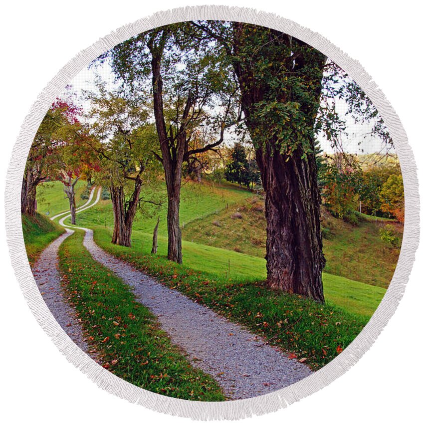 Landscapes Round Beach Towel featuring the photograph The Long Road in Autumn by Mike Murdock
