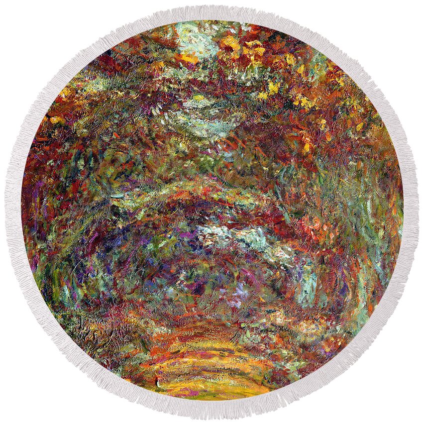 The Round Beach Towel featuring the painting The Rose Path Giverny by Claude Monet
