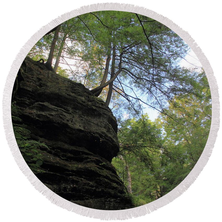 Old Man's Cave Round Beach Towel featuring the photograph Trees Hanging Over Cliff by Angela Murdock
