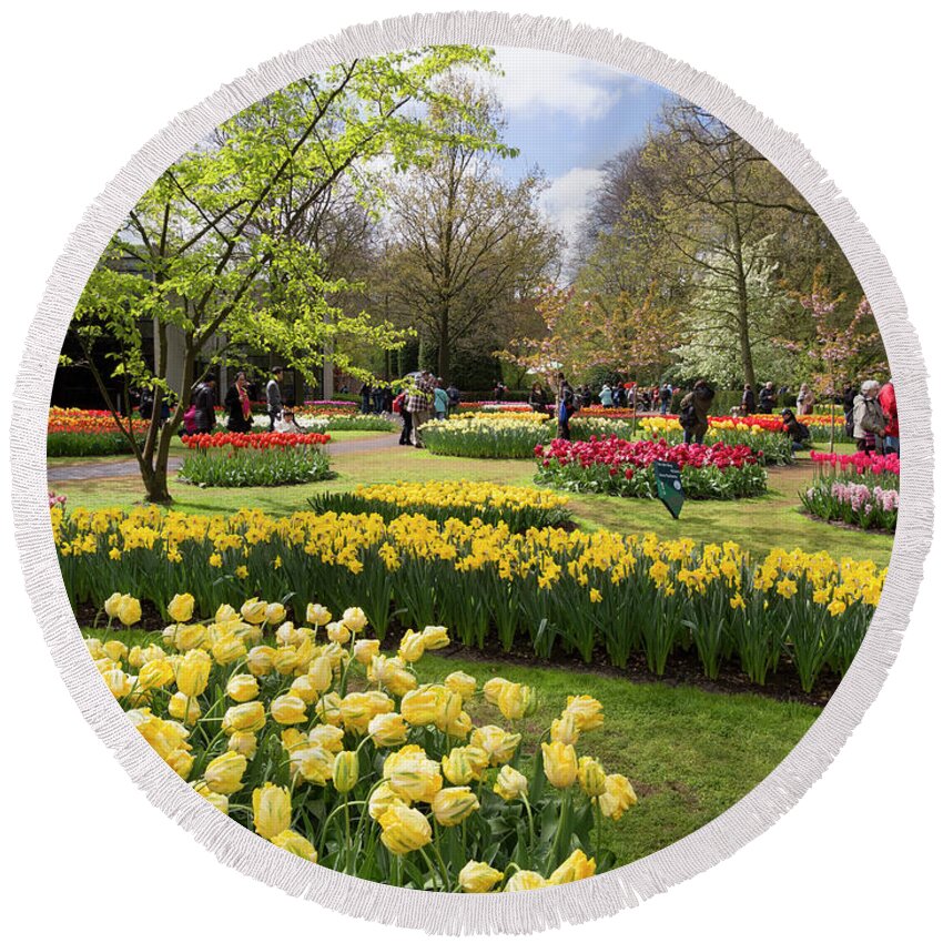Tulips Round Beach Towel featuring the photograph Tulips and other spring bulbs at Keukenhof Gardens Holland by Louise Heusinkveld