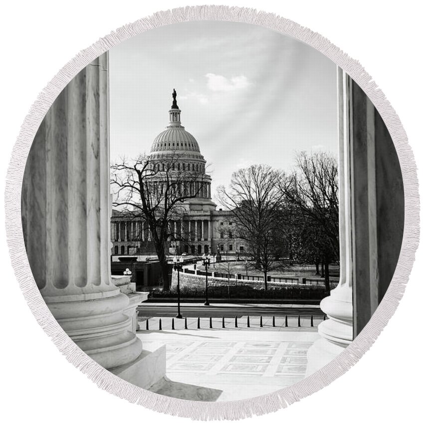 Statue Round Beach Towel featuring the photograph View of Capitol Hill through the Supreme Court by Brandon Bourdages