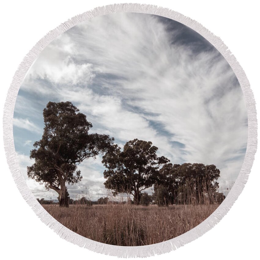 Clouds Round Beach Towel featuring the photograph Watching clouds float across the sky by Linda Lees