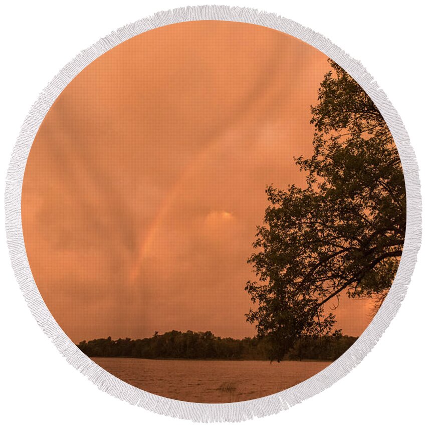 Orange Dawn Round Beach Towel featuring the photograph Strange orange sunrise with rainbow by Gary Eason