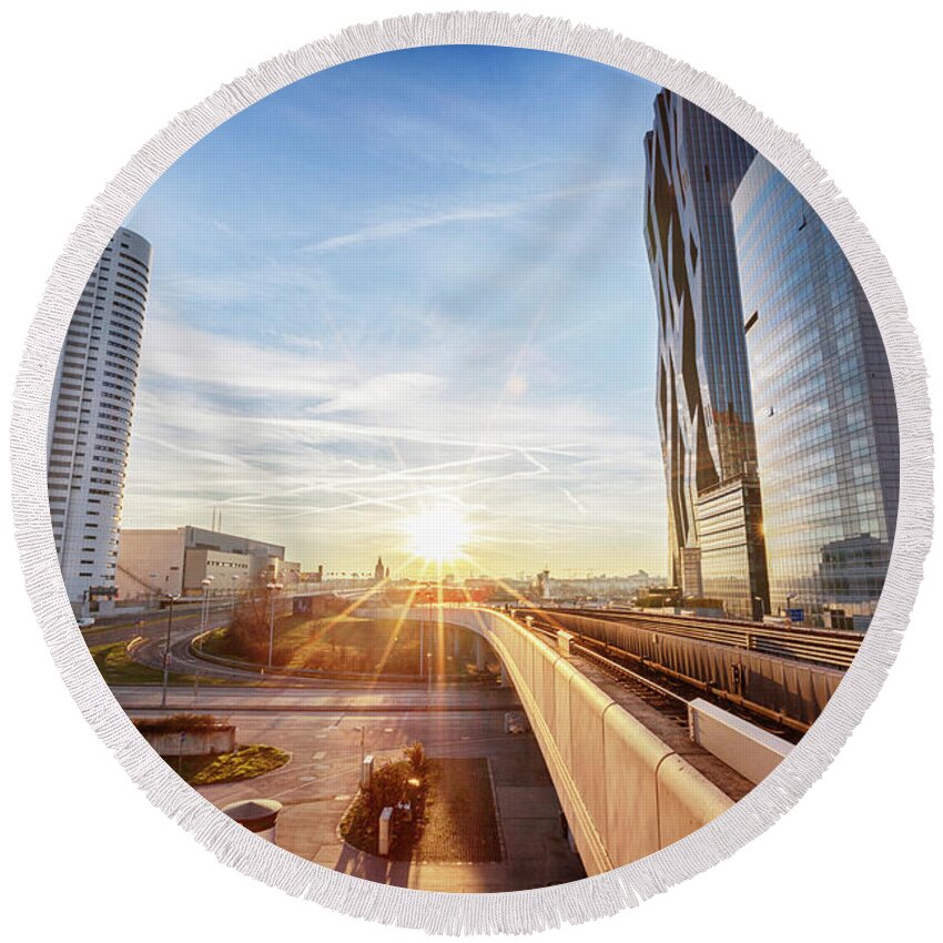 City Round Beach Towel featuring the photograph winter sunset near Vienna busness center and metro line by Ariadna De Raadt