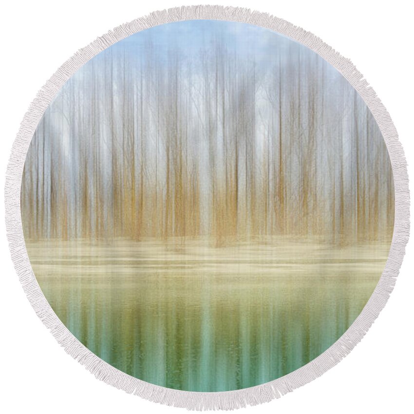 Meramec River Round Beach Towel featuring the photograph Winter trees on a river bank reflecting into water by Robert FERD Frank