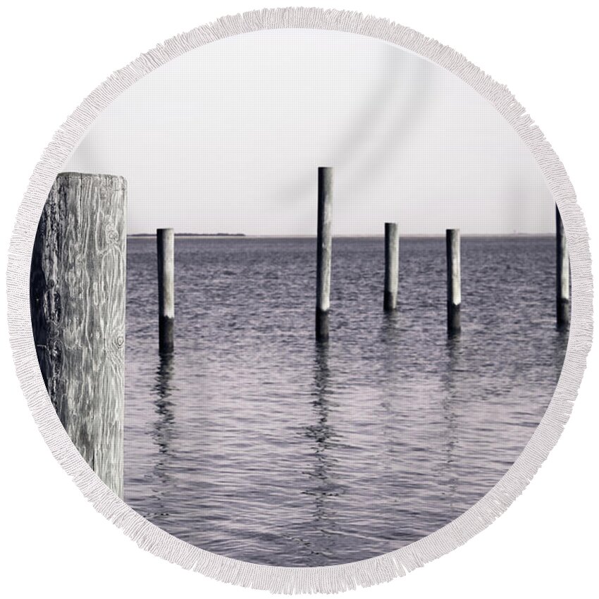 Wood Pilings Round Beach Towel featuring the photograph Wood Pilings in Monotone by Colleen Kammerer