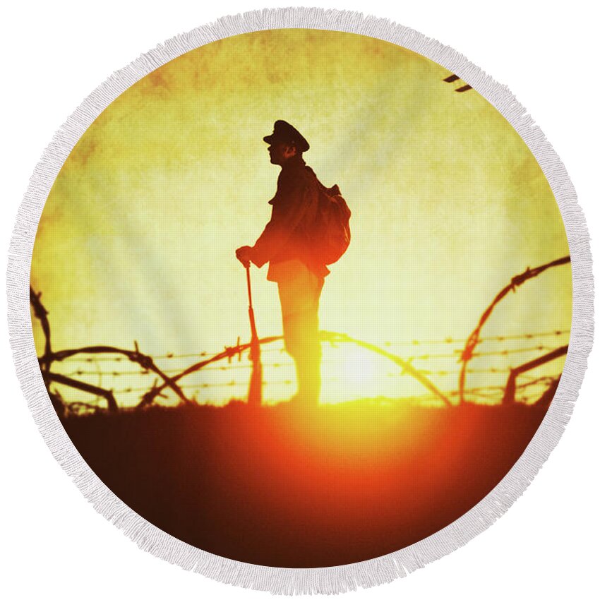 World War One; Wwi; Ww1; First World War; Soldier; Trenches; Rifle; Tin Helmet; Infantry; Infantryman; Man; Khaki; Kaki; Anonymous; Full Length; Outside; Outdoors; Silhouette; Silhouettes; Silhouetted; Sunset; Sunrise; Dusk; Dawn; 1914 - 1918; Historic; Historical; Wartime; Peaked Cap; Battlefield; Uniform; Military; Gun; Weapon; Profile; Alone; Standing; Full Length; Barbed Wire; Front Line Round Beach Towel featuring the photograph World War One Soldier by Lee Avison
