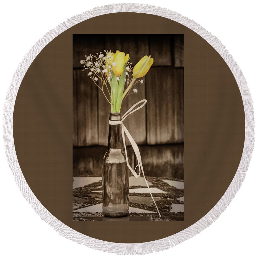 Terry D Photography Round Beach Towel featuring the photograph Yellow Tulips in Glass Bottle Sepia by Terry DeLuco