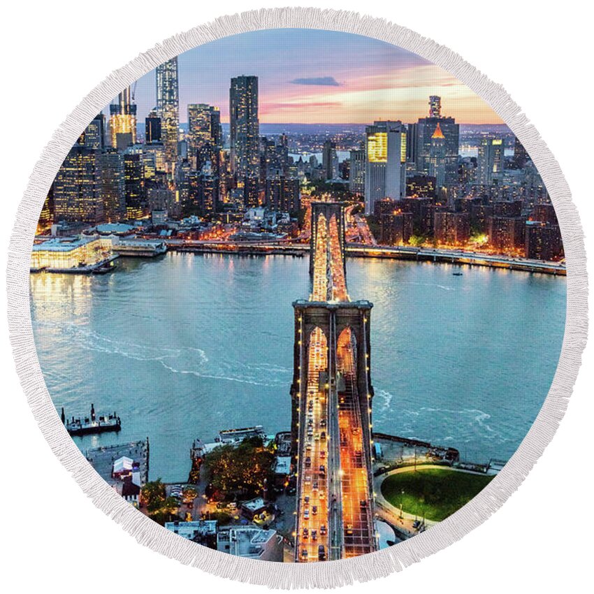 Brooklyn Bridge Round Beach Towel featuring the photograph Aerial of New York city and Brooklyn bridge at dusk #1 by Matteo Colombo