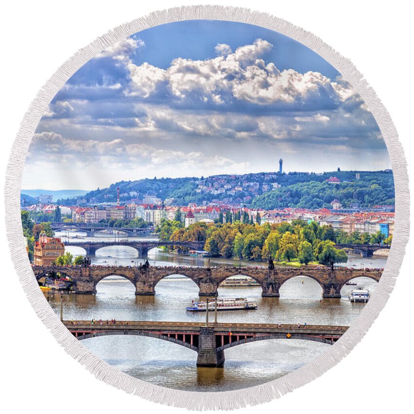 River Round Beach Towel featuring the photograph Bridge and rooftops of Prague #6 by Vivida Photo PC