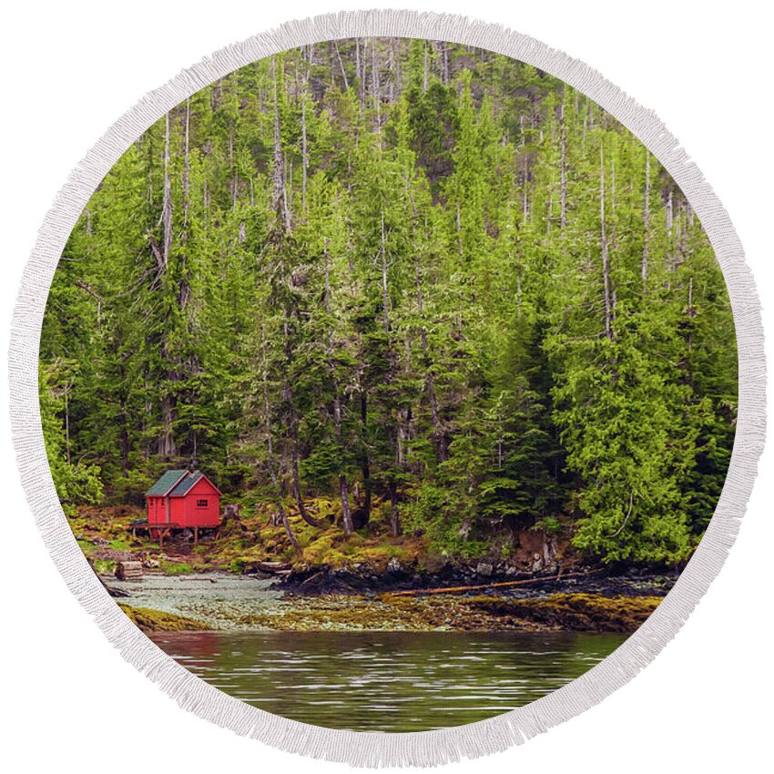Alaska Round Beach Towel featuring the photograph Red Cabin on Edge of Alaskan Waterway in Evergreen Forest #1 by Darryl Brooks
