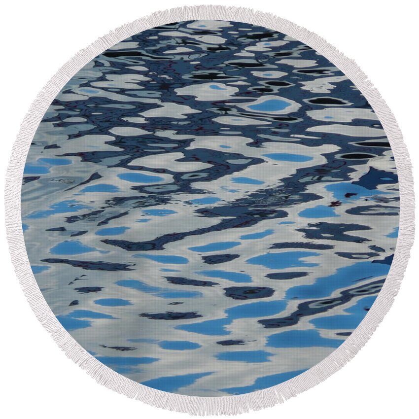Water Round Beach Towel featuring the photograph Texture of water ripples on the surface of the river #1 by Oleg Prokopenko