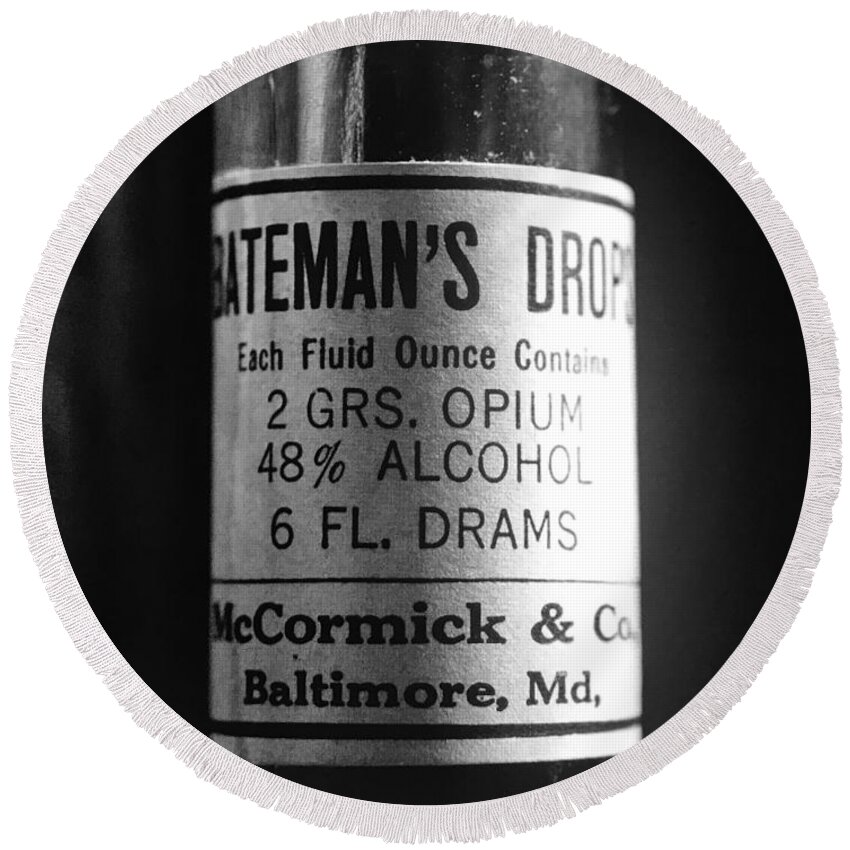 Bateman's Drops Round Beach Towel featuring the photograph Antique McCormick and Co Baltimore MD Bateman's Drops Opium Bottle Label - Black and White by Marianna Mills