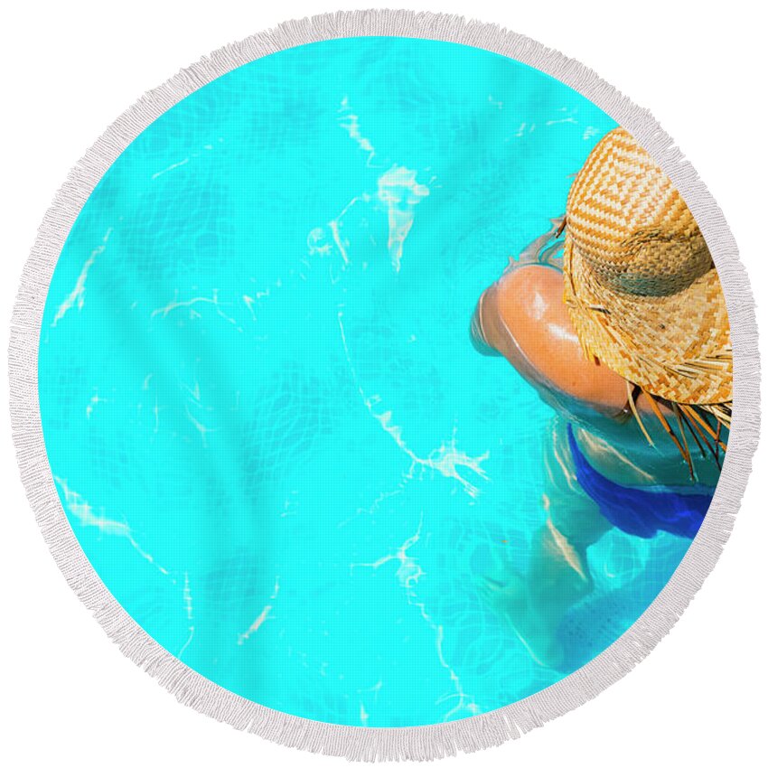 Beautiful Round Beach Towel featuring the photograph Woman in a pool with hat relaxed and rested. #4 by Joaquin Corbalan