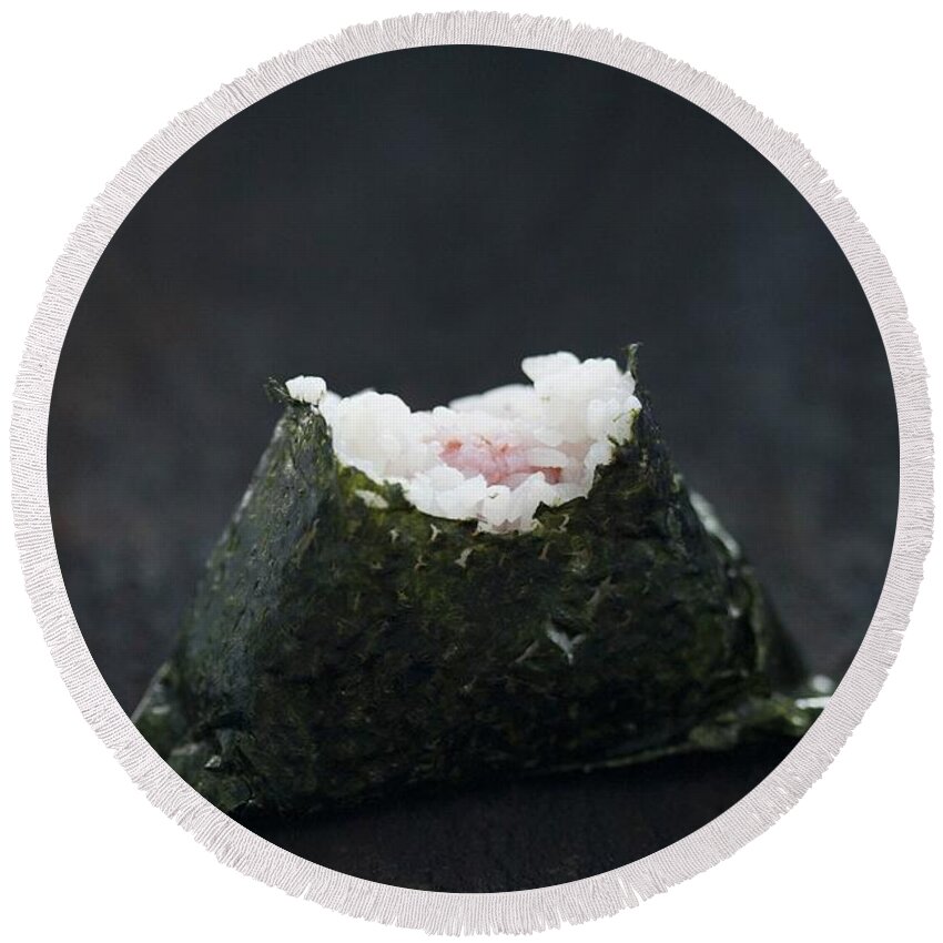 Ip_11351762 Round Beach Towel featuring the photograph An Onigiri Sushi With A Bite Taken Out by Martina Schindler