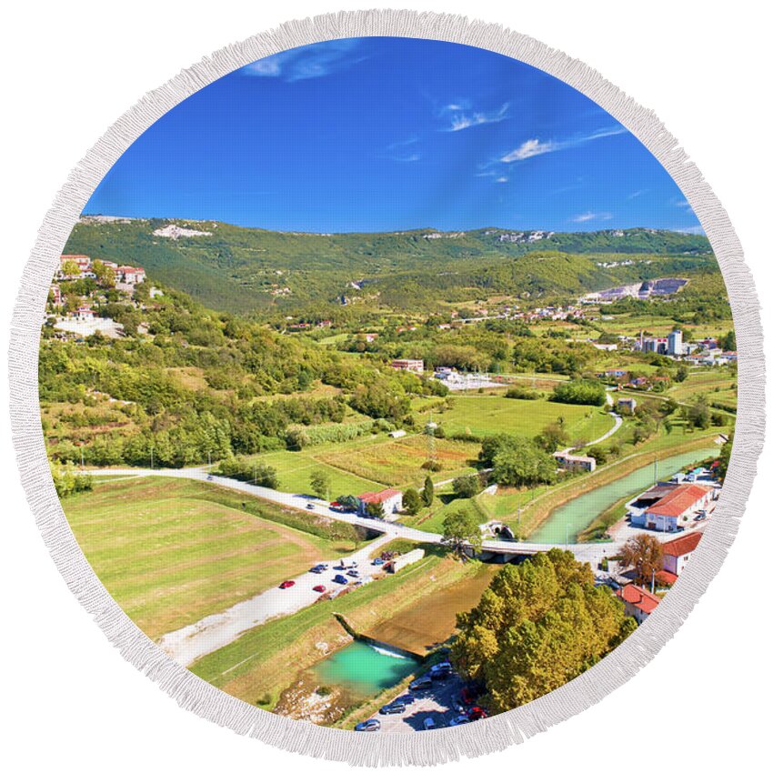 Buzet Round Beach Towel featuring the photograph Buzet. Hill town of Buzet and Mirna river in green landscape aer by Brch Photography