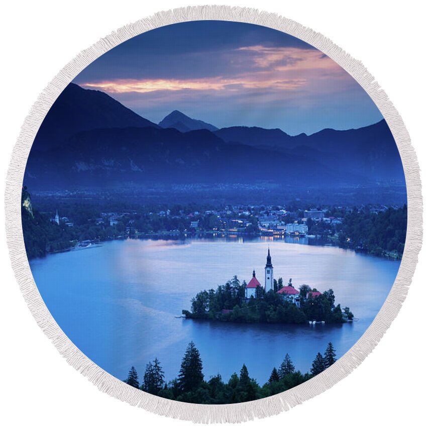 Bled Round Beach Towel featuring the photograph Dawn view of Lake Bled from Ojstrica by Ian Middleton