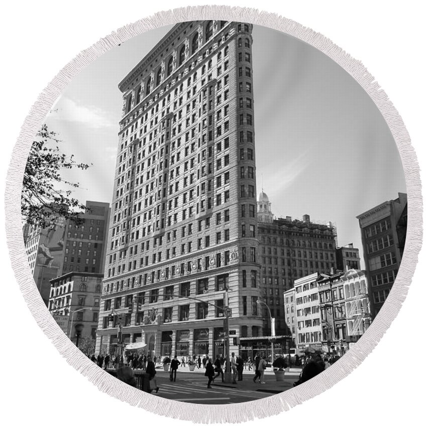 Flatiron Round Beach Towel featuring the photograph Flatiron Building NYC from a busy sidewalk by Patricia Caron