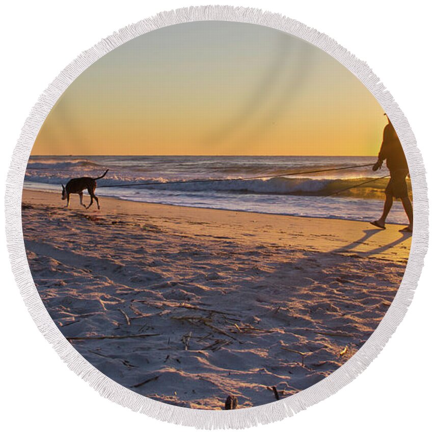 Sunrise Photographs Round Beach Towel featuring the photograph Man's Best Friend on Beach by Phil Mancuso