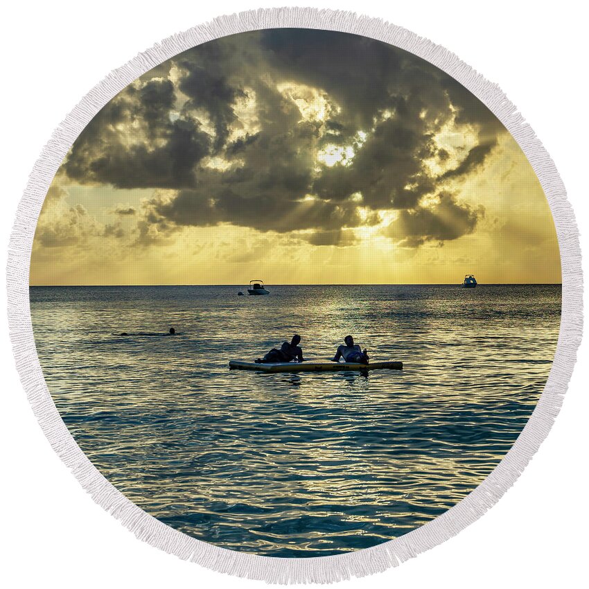 Estock Round Beach Towel featuring the digital art Men On Float At Sunset, Cayman Is by Angela Pagano