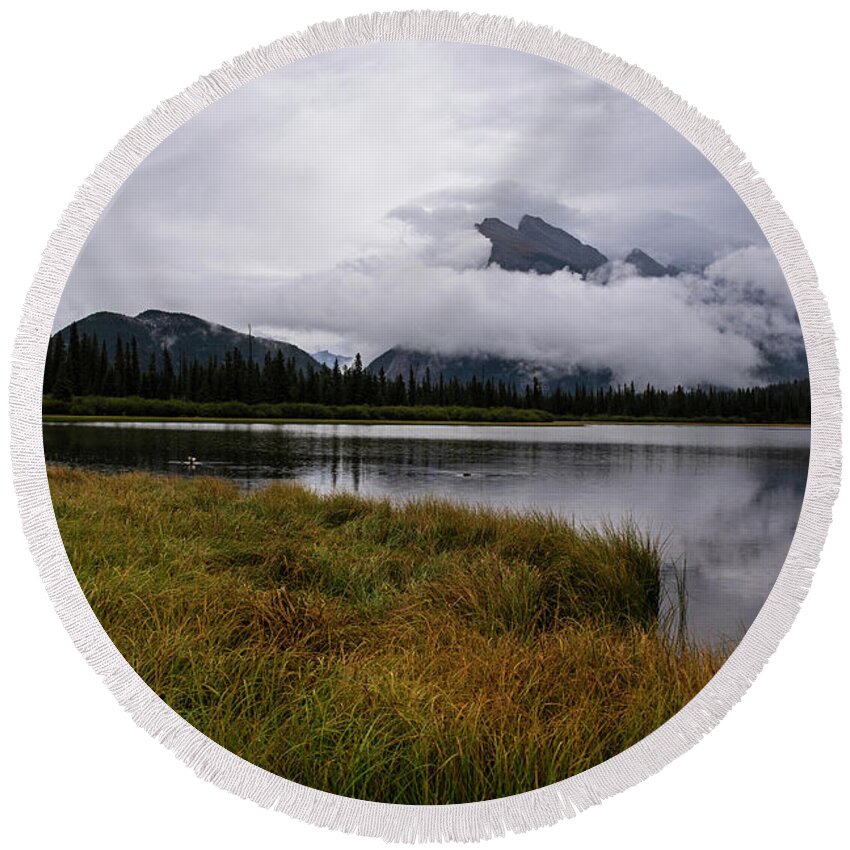 Banff Round Beach Towel featuring the photograph Misty day on Vermillion Lake Banff Canada Alberta Clouds by Toby McGuire