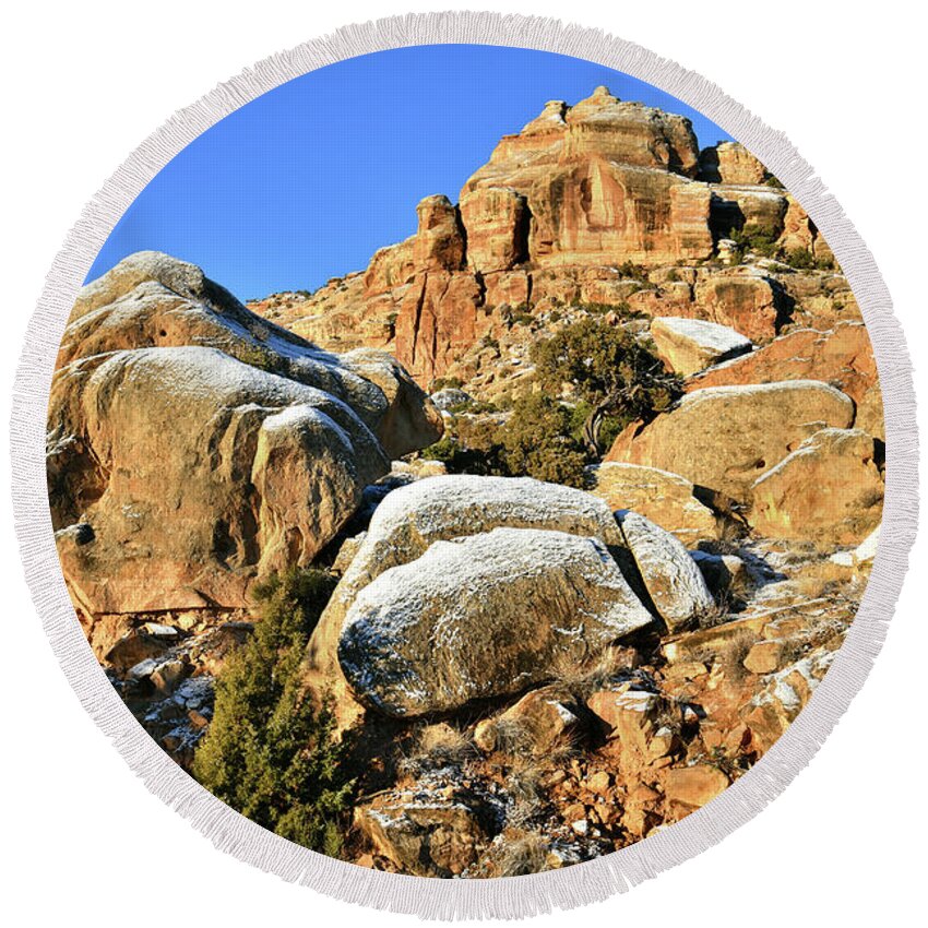 Colorado National Monument Round Beach Towel featuring the photograph Morning Light on Buttes along Rim Rock Drive in CO National Monument by Ray Mathis