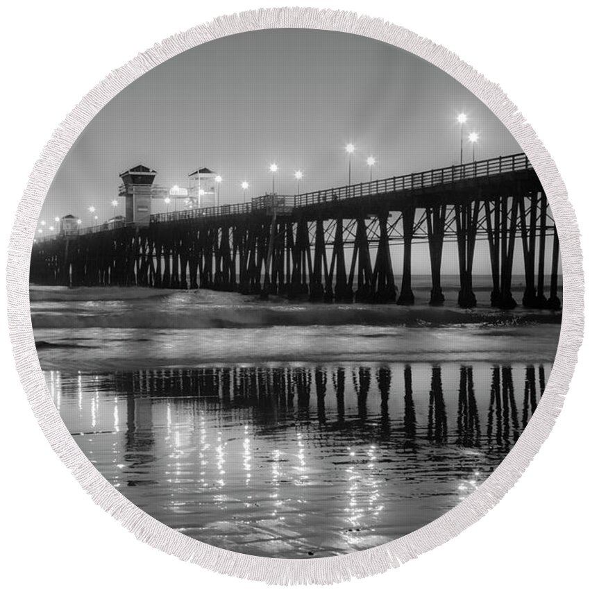 Oceanside Pier Round Beach Towel featuring the photograph Oceanside California Pier Night Lights Black and White by Catherine Walters