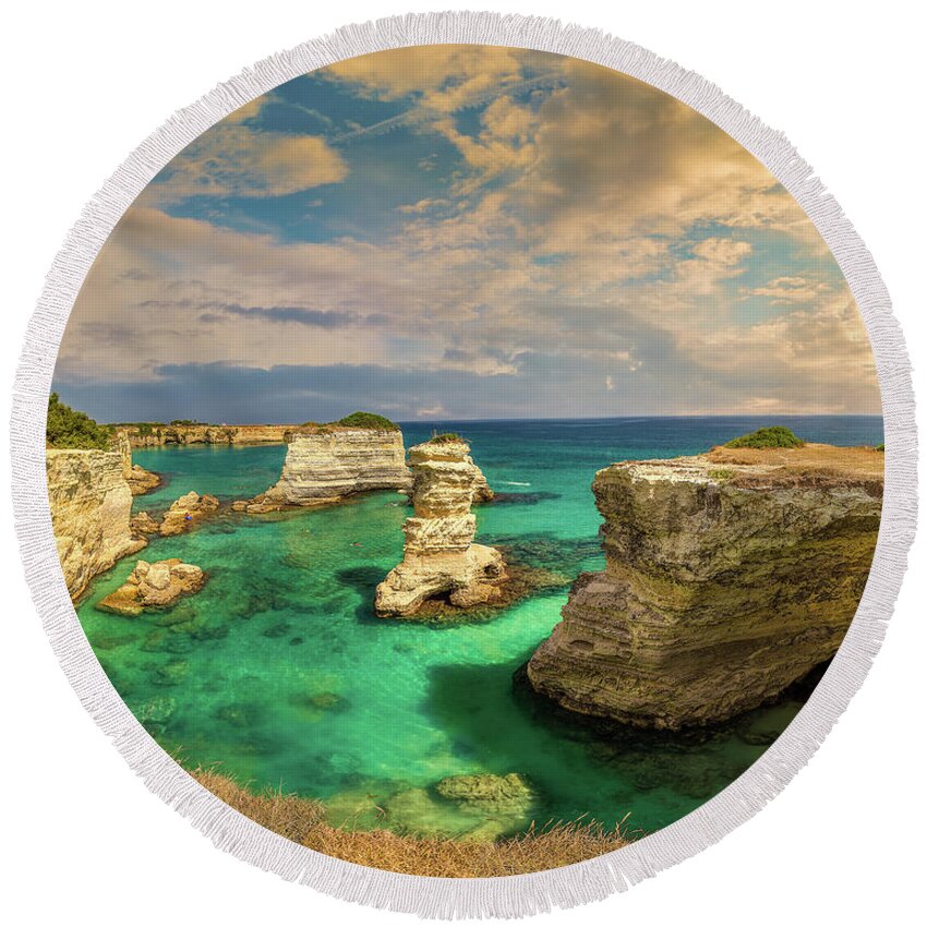 Italy Round Beach Towel featuring the photograph Panoramic view of stacks of Salento in Italy by Vivida Photo PC