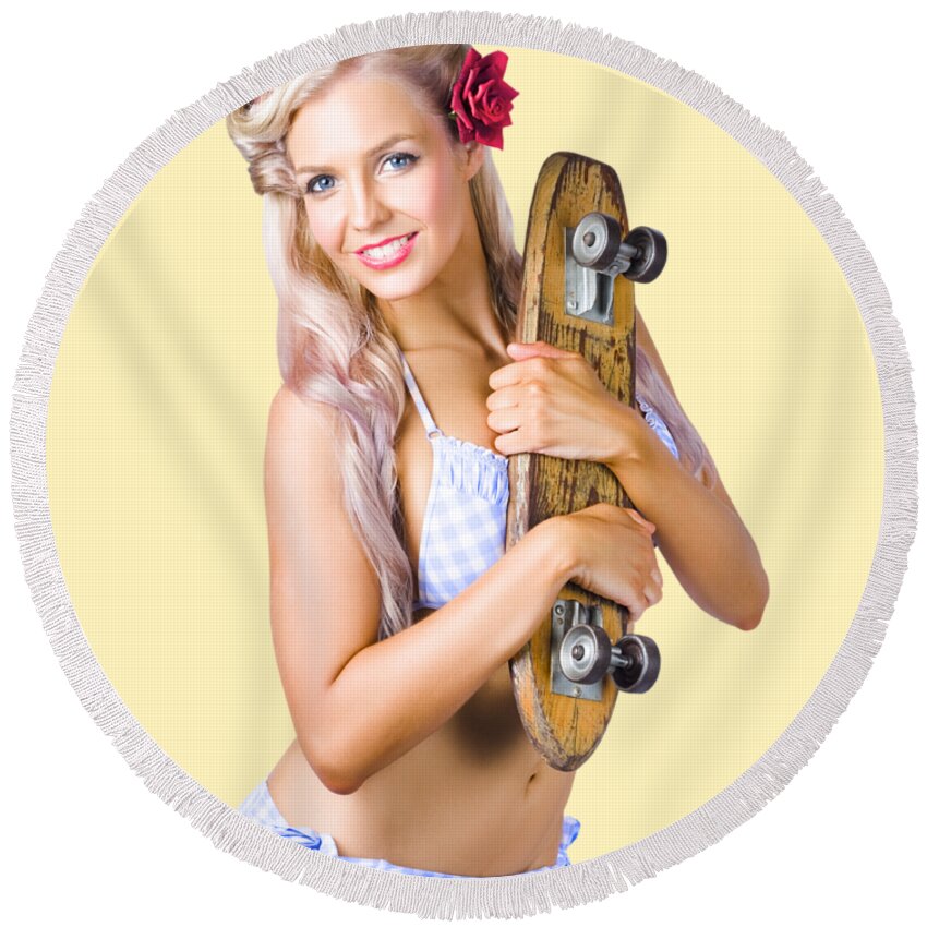 Skate Round Beach Towel featuring the photograph Pinup woman in bikini holding skateboard by Jorgo Photography