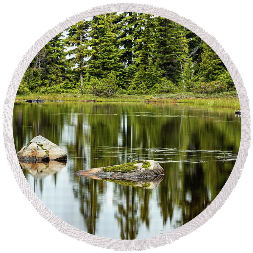 Landscapes Round Beach Towel featuring the photograph Rocks In A Mountain Pond by Claude Dalley
