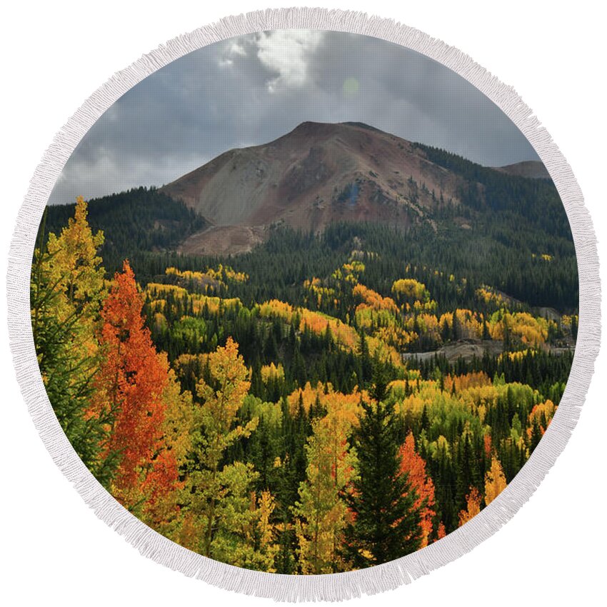 Red Mountain Pass Round Beach Towel featuring the photograph Rolling Clouds above Red Mountain and Fall Colors by Ray Mathis