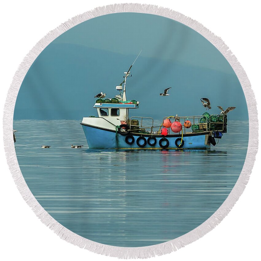 Animal Round Beach Towel featuring the photograph Small Fishing Boat With Lobster Pods And Seagulls On Calm Atlantic In Front Of The Hebride Islands by Andreas Berthold