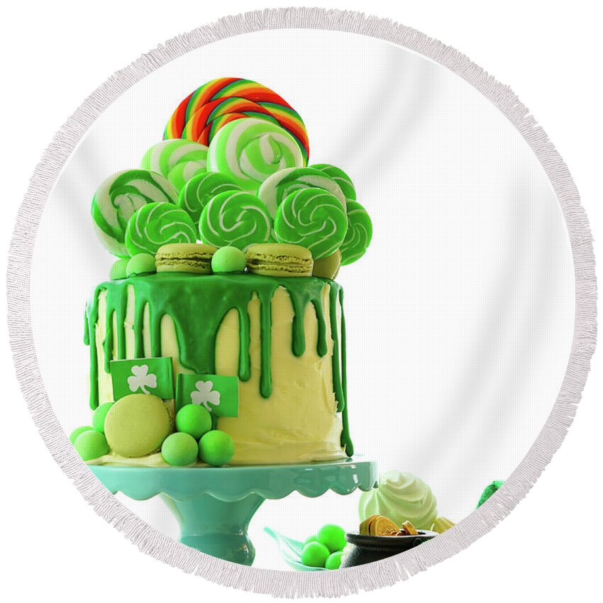 Paddy Round Beach Towel featuring the photograph St Patrick's Day theme lollipop candy land drip cake. by Milleflore Images