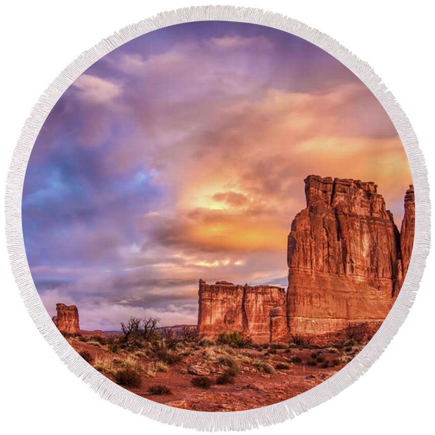 Arches National Park Round Beach Towel featuring the photograph Sunrise on The Organ, Tower of Babel and the Three Gossips by Brenda Jacobs