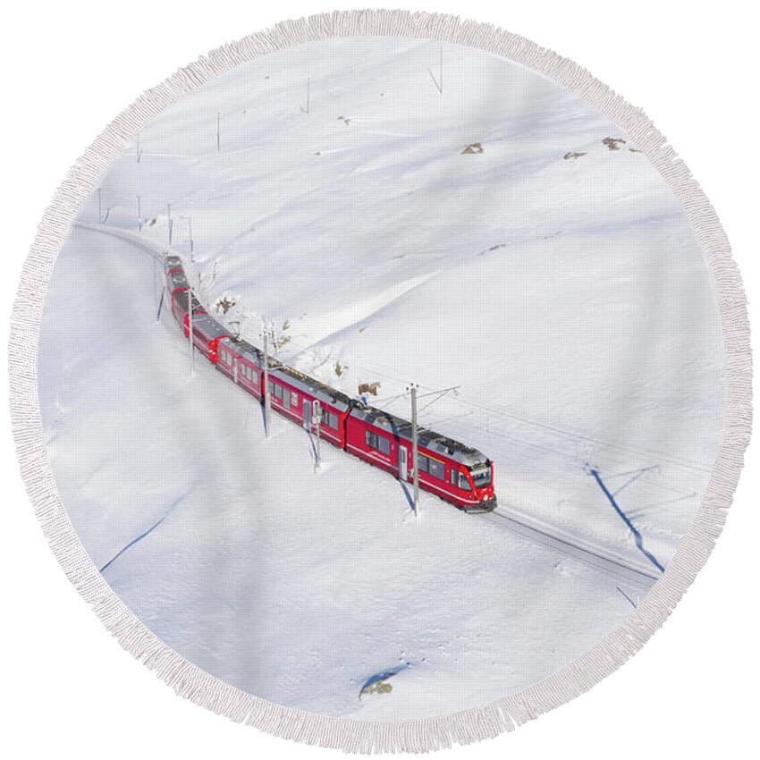 Estock Round Beach Towel featuring the digital art Switzerland, Graubunden, Grisons, Engadin, Alps, The Bernina Express Train At The Bernina Pass by Alessandro Bellani