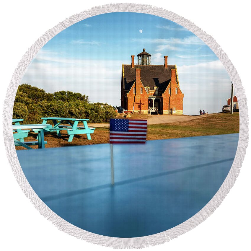 Estock Round Beach Towel featuring the digital art Usa, Block Island, Rhode Island, New England, Little Usa Flag, Southeast Lighthouse, Blue Wooden Picnic Tables. by Andres Uribe