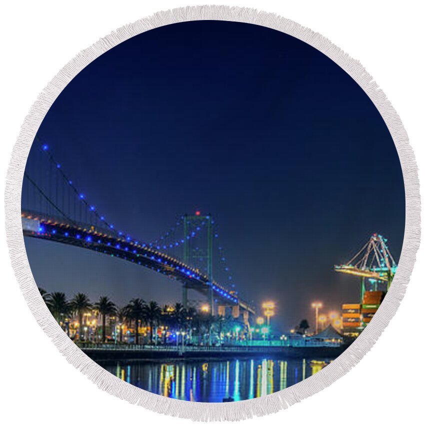 Vincent Thomas Gantry Cranes Lit At Night Round Beach Towel featuring the photograph Vincent Thomas Gantry Cranes Lit at Night by David Zanzinger
