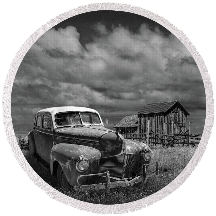 Landscape Round Beach Towel featuring the photograph Vintage Automobile and Wooden Barn with Windmill in Black and White by Randall Nyhof