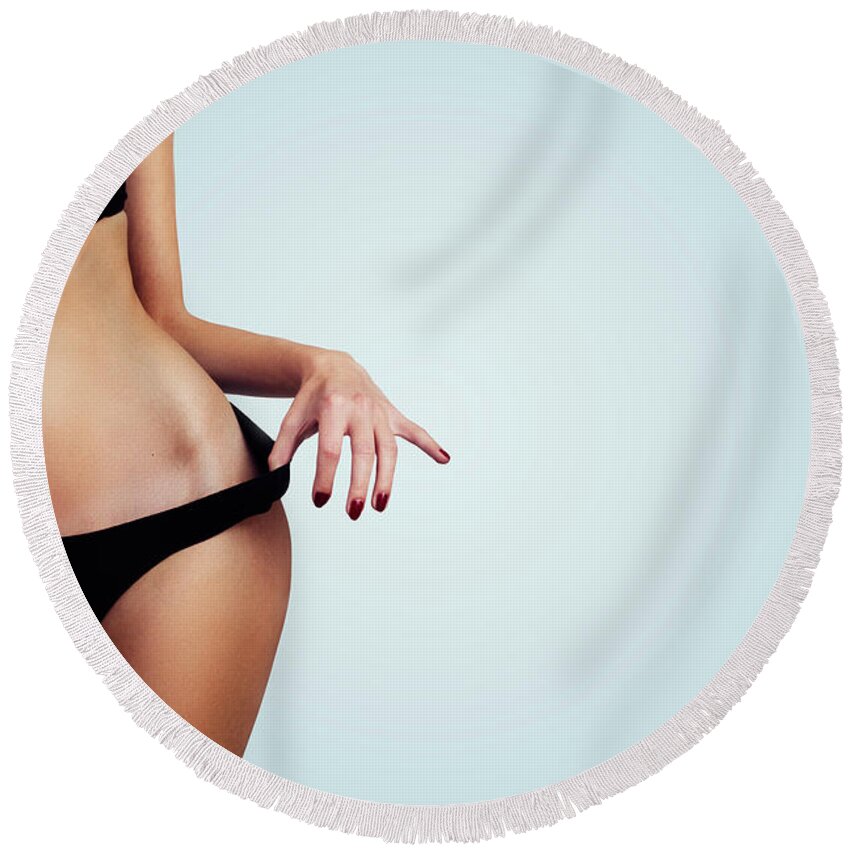 Woman Round Beach Towel featuring the photograph Woman with perfect figure and skin. by Jelena Jovanovic