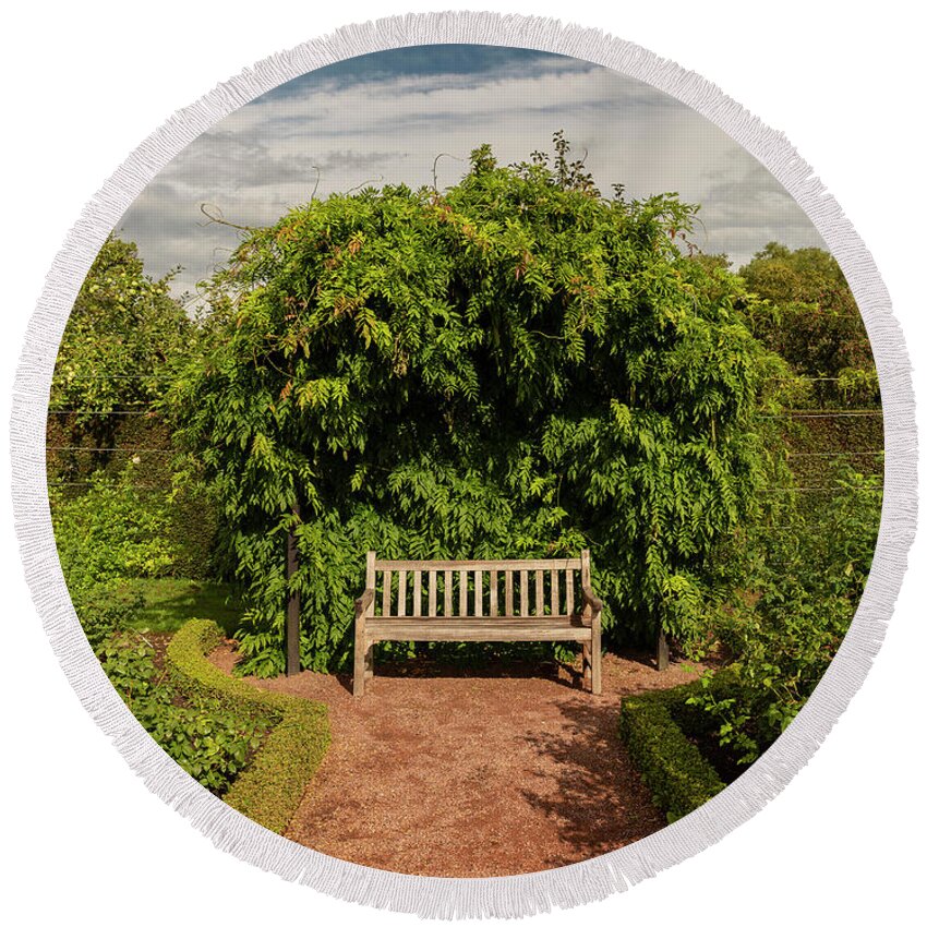 Hedge Round Beach Towel featuring the photograph Wooden garden bench by Sophie McAulay