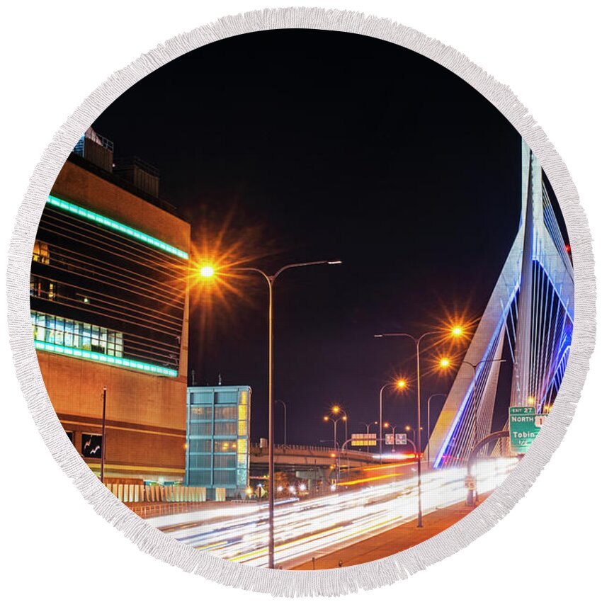 Boston Round Beach Towel featuring the photograph Zakim Bridge and TD Garden Boston MA long exposure by Toby McGuire