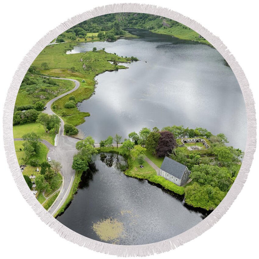 Ireland Round Beach Towel featuring the photograph Aerial drone landscape of St. Finbarr oratory Church, Gougane Barra, cork West Ireland. by Michalakis Ppalis