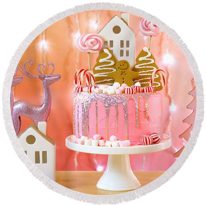 Christmas Round Beach Towel featuring the photograph Candy land Christmas cake in pink and gold party table setting. #1 by Milleflore Images